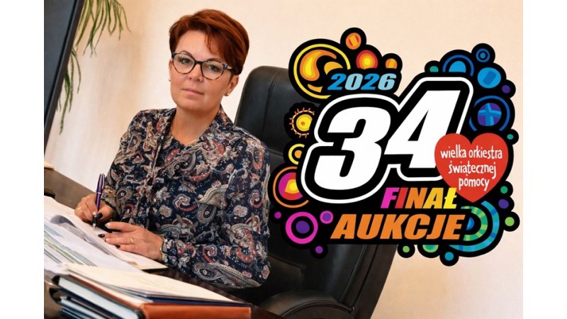 Kobieta siedzi przy biurku i podpisuje dokumenty. Po prawej stronie widoczna jest grafika „34. Finał – Aukcje – Wielka Orkiestra Świątecznej Pomocy 2026”.